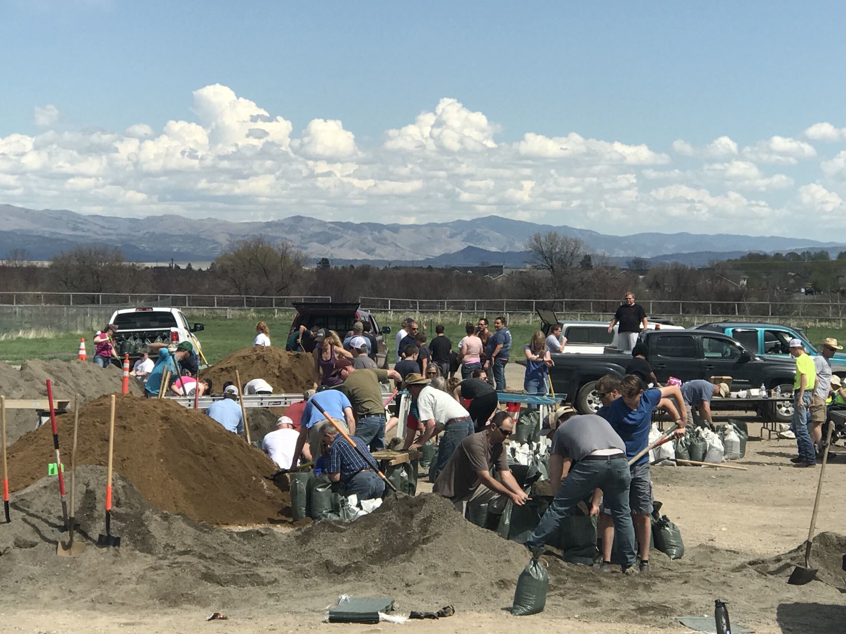 Volunteers help fill sandbags